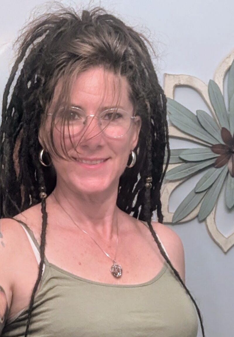Jessica Radli, owner of Custom Hair Creations, smiling.